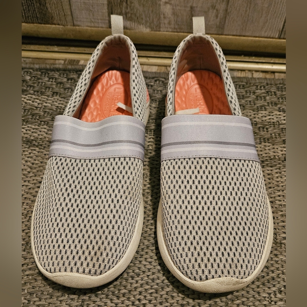 Crocs Women's LiteRide Mesh Slip-On shoes in a pearl white/grey colorway. 10